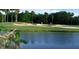 Picturesque golf course with a scenic water feature at 603 Russ Pond Dr, Kissimmee, FL 34759
