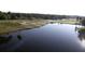 Beautiful golf course featuring a tranquil water hazard at 603 Russ Pond Dr, Kissimmee, FL 34759
