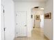 Well-lit hallway with tile flooring, archway and neutral decor at 603 Russ Pond Dr, Kissimmee, FL 34759