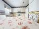 Spacious kitchen featuring white appliances and tile flooring at 603 Russ Pond Dr, Kissimmee, FL 34759