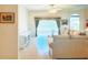 Bright living room featuring neutral walls, tile floors, and sliding glass doors at 603 Russ Pond Dr, Kissimmee, FL 34759