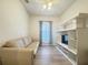 Cozy living room with a comfortable sofa and entertainment center at 603 Russ Pond Dr, Kissimmee, FL 34759