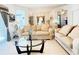 Open-concept living room featuring tile floors and modern furnishings at 603 Russ Pond Dr, Kissimmee, FL 34759