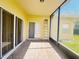 A view of the covered patio, which features brick pavers and a screen enclosure at 603 Russ Pond Dr, Kissimmee, FL 34759
