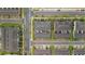 A bird's-eye view of a townhome community, with garages, parking, and street access at 6067 Blue Lily Way, Winter Garden, FL 34787