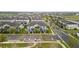 Aerial view of a neighborhood with townhomes, green spaces, and convenient access to the highway at 6067 Blue Lily Way, Winter Garden, FL 34787