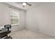 Bedroom features neutral walls, window, and space for customization at 6067 Blue Lily Way, Winter Garden, FL 34787