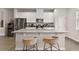 Kitchen island with granite countertops and bar seating at 6067 Blue Lily Way, Winter Garden, FL 34787