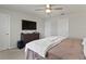 Well-lit main bedroom features a ceiling fan, and neutral decor at 6067 Blue Lily Way, Winter Garden, FL 34787