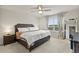 Spacious main bedroom features a ceiling fan, a large window, and neutral decor at 6067 Blue Lily Way, Winter Garden, FL 34787