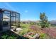 Enjoy the spacious, landscaped backyard from this screened-in patio at 637 Conservation Blvd, Groveland, FL 34736