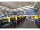 Upscale bar area with modern finishes, ample seating, and a fully stocked counter for residents at 637 Conservation Blvd, Groveland, FL 34736