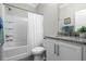 Clean bathroom features tile, a bathtub/shower combination and single sink at 637 Conservation Blvd, Groveland, FL 34736