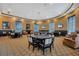 Community game room with poker tables and seating, offering a place for residents to gather at 637 Conservation Blvd, Groveland, FL 34736