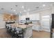 This expansive kitchen offers lots of counter seating, modern appliances and sleek countertops at 637 Conservation Blvd, Groveland, FL 34736