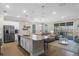 Open concept living area with a kitchen island and sliding glass doors to the patio at 637 Conservation Blvd, Groveland, FL 34736