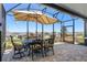 Enjoy outdoor dining on this screened patio with views of the neighborhood at 637 Conservation Blvd, Groveland, FL 34736