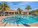 Resort-style pool with lap lanes, lounge chairs, and shade umbrellas, perfect for relaxing at 637 Conservation Blvd, Groveland, FL 34736