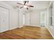Spacious bedroom with wood floors, a ceiling fan, and neutral paint at 703 Sailfish Rd, Winter Springs, FL 32708