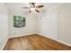 Bedroom featuring a ceiling fan, wood floors, and sliding closet doors at 703 Sailfish Rd, Winter Springs, FL 32708