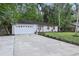 Front exterior showcasing the home's facade, driveway, and well-maintained lawn at 703 Sailfish Rd, Winter Springs, FL 32708