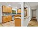 Well-lit kitchen features granite countertops, stainless steel appliances, and decorative backsplash at 703 Sailfish Rd, Winter Springs, FL 32708