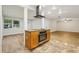 Updated kitchen island with granite countertops and stainless steel oven at 703 Sailfish Rd, Winter Springs, FL 32708