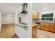 Spacious kitchen with stainless steel appliances and large window for ample natural light at 703 Sailfish Rd, Winter Springs, FL 32708
