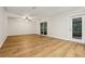 Spacious living room features new flooring and a sliding door to the patio at 703 Sailfish Rd, Winter Springs, FL 32708