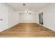 Empty living room features new flooring and a sliding door to the patio at 703 Sailfish Rd, Winter Springs, FL 32708