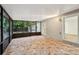 Enclosed porch with tile flooring provides an outdoor space for relaxation and entertaining at 703 Sailfish Rd, Winter Springs, FL 32708
