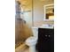 This bathroom features tiled shower with overhead shower and a vanity at 7520 Marietta St, Orlando, FL 32807
