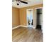 This bedroom offers wood-look floors and an ensuite bathroom for a luxurious feel at 7520 Marietta St, Orlando, FL 32807