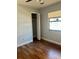 The bedroom features wood-look floors and a closet for ample storage at 7520 Marietta St, Orlando, FL 32807