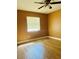 This bedroom includes wood-look floors and a window for natural light at 7520 Marietta St, Orlando, FL 32807