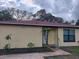 Charming single-story home with a well-maintained lawn and mature trees at 7520 Marietta St, Orlando, FL 32807