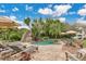 Picturesque backyard with a luxury pool, grotto waterfall, sun umbrellas, & inviting lounge area at 8244 Oakland Pl, Orlando, FL 32819