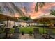 Charming backyard scene with lounge chairs, manicured lawn, and mature trees creating a peaceful and inviting outdoor space at 8244 Oakland Pl, Orlando, FL 32819