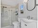 Clean bathroom featuring a glass shower, vanity sink, and sleek fixtures at 8244 Oakland Pl, Orlando, FL 32819