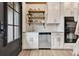 Well-organized kitchen with stainless steel appliances, custom cabinets, open shelving, and backyard access at 8244 Oakland Pl, Orlando, FL 32819