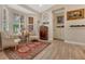 Comfortable sitting area features a bay window with plantation shutters and hardwood flooring throughout at 8244 Oakland Pl, Orlando, FL 32819