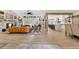Open-concept floor plan seamlessly connects living room with built-in shelving and gourmet kitchen at 8244 Oakland Pl, Orlando, FL 32819