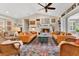 Well-appointed living room with a vaulted ceiling, fireplace, and comfortable seating arrangement at 8244 Oakland Pl, Orlando, FL 32819