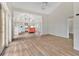 Spacious living room showcasing hardwood floors and an open floor plan to the kitchen at 8244 Oakland Pl, Orlando, FL 32819