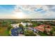 Stunning aerial view of a luxurious waterfront community with beautiful homes and lush greenery at 8336 Boyla Ct, Windermere, FL 34786