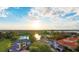 Stunning aerial view of a luxury estate surrounded by lush landscapes, showcasing a private lake and community at 8336 Boyla Ct, Windermere, FL 34786
