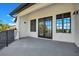 Elegant balcony featuring stucco exterior, French doors and large windows with scenic views at 8336 Boyla Ct, Windermere, FL 34786