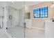 Modern bathroom with a glass shower enclosure and separate makeup vanity at 8336 Boyla Ct, Windermere, FL 34786