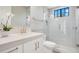 Elegant bathroom featuring white cabinetry, quartz counters, and a glass-enclosed shower at 8336 Boyla Ct, Windermere, FL 34786