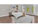 Serene bedroom with a plush bed, soft lighting, and hardwood floors at 8336 Boyla Ct, Windermere, FL 34786